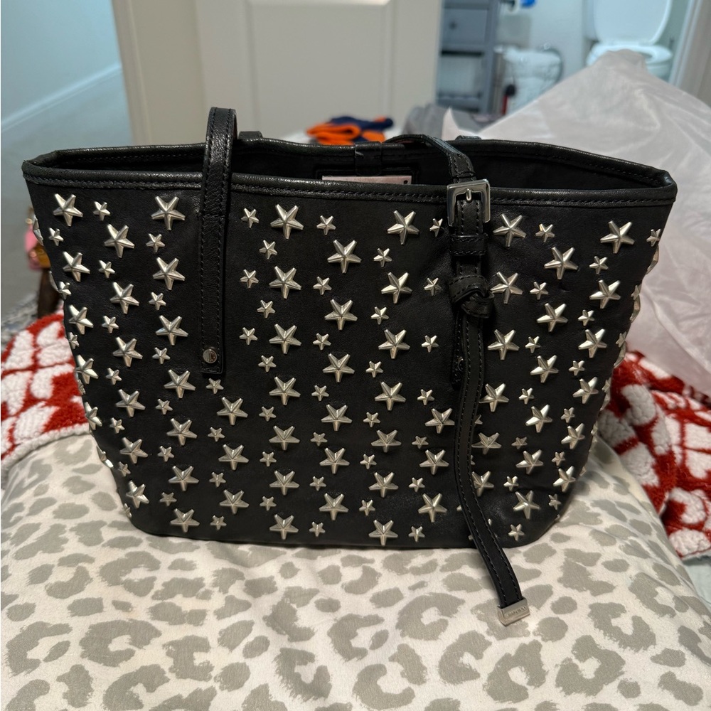 Black star studded Jimmy Choo tote. Comes with certificate of authenticity.